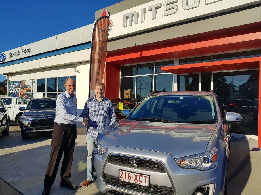 DRIVE AWAY HAPPY: Ben Noffke of Scenic Motors Mitsubishi congratulates Chad Tilly on the purchase of a Mitsubishi ASX. Photo: Supplied 