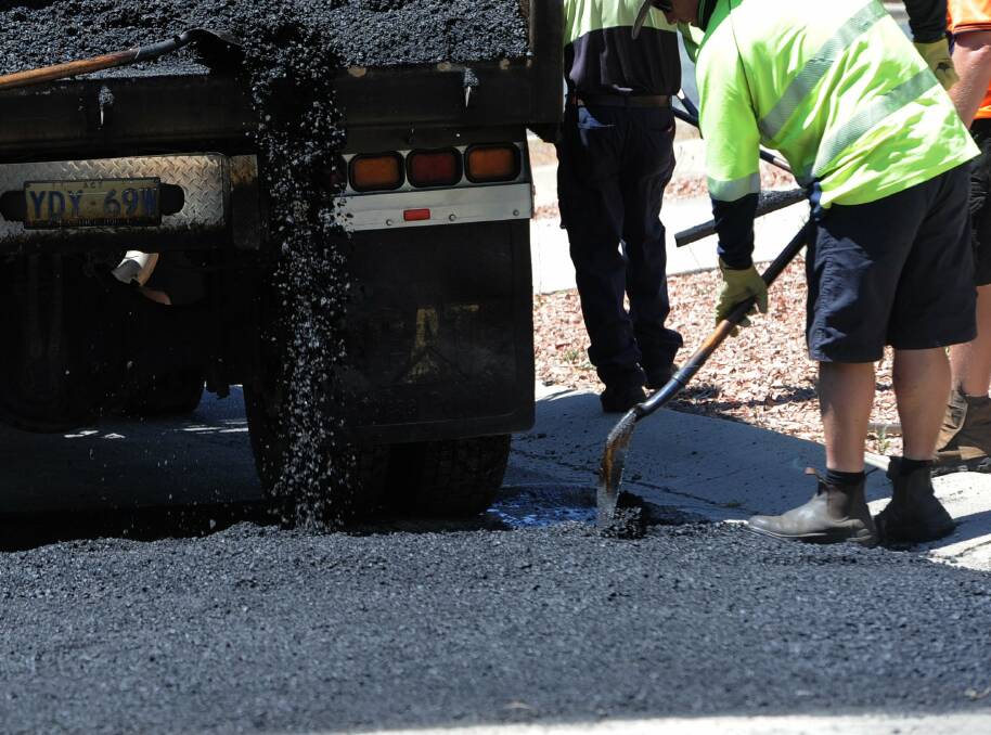 WARNING TO RESIDENTS: The Office of Fair Trading is urging Logan residents to be wary of tradesmen offering to lay bitumen for upfront cash payments. Photo: Graham Tidy.