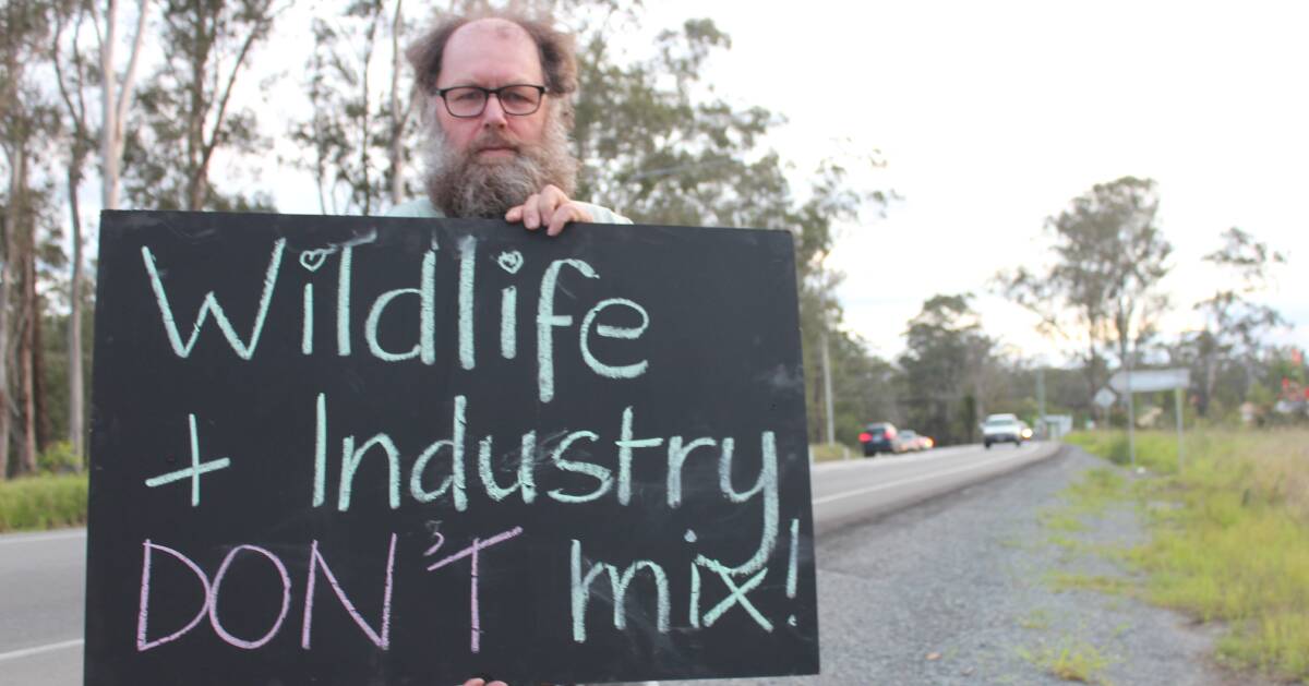 NOT HERE: North Maclean resident Peter Hodges has set up a roadside protest beside Mt Lindesay Highway to protest the proposed North Maclean industrial estate.