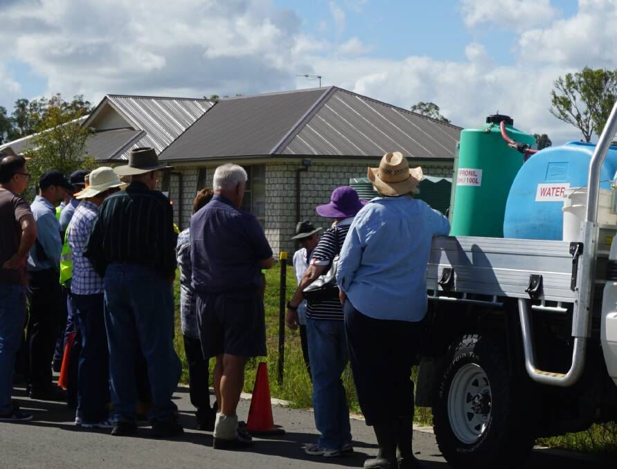 GETTING THE MESSAGE OUT: Fire ant staff talk to locals at Woodhill in the Scenic Rim about the latest infestations. Fire ant staff say about 40 locals turned out to learn about the biting pests.