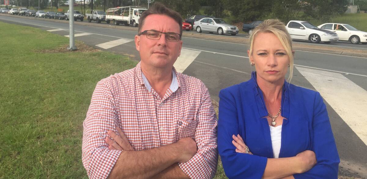 CLOGGED HIGHWAY: Luke Smith and Trevina Schwarz want funds diverted to the Mt Lindesay Highway.