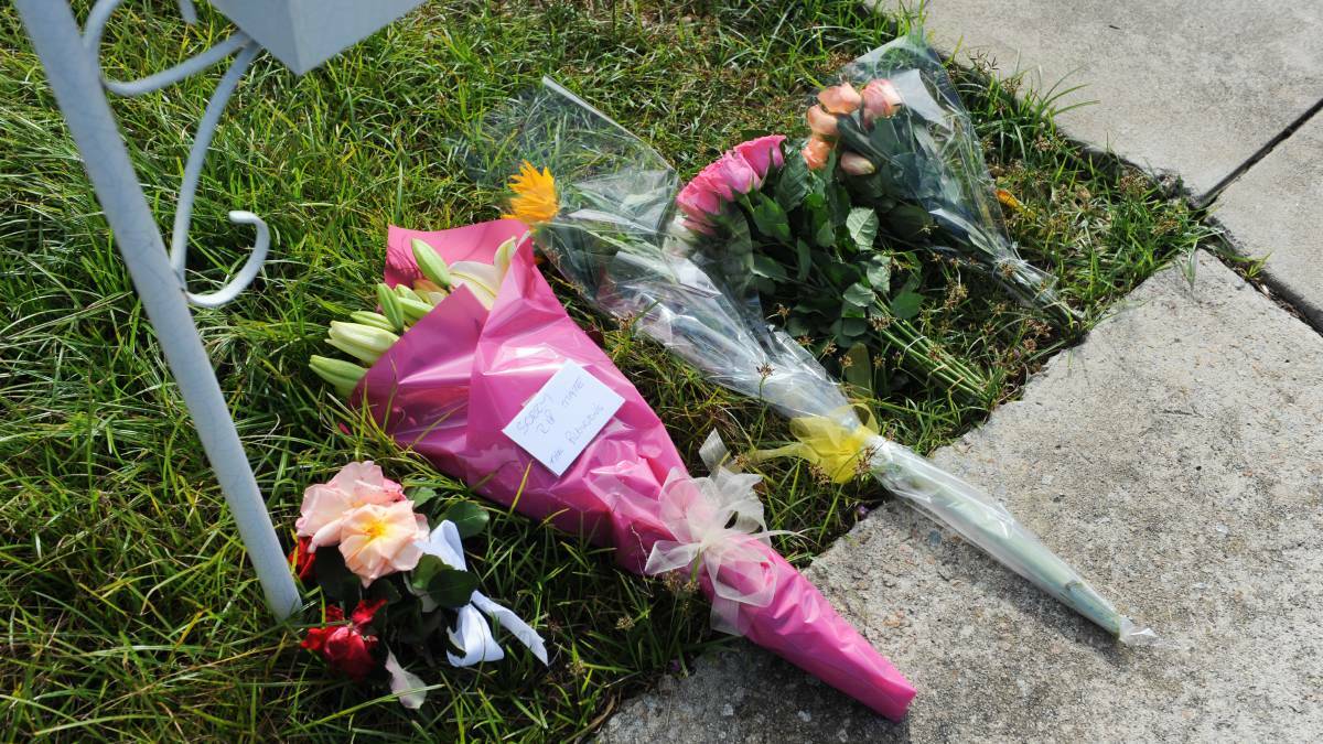 Floral tributes laid outside the Belle Avenue home. Photo: Mark Jesser
