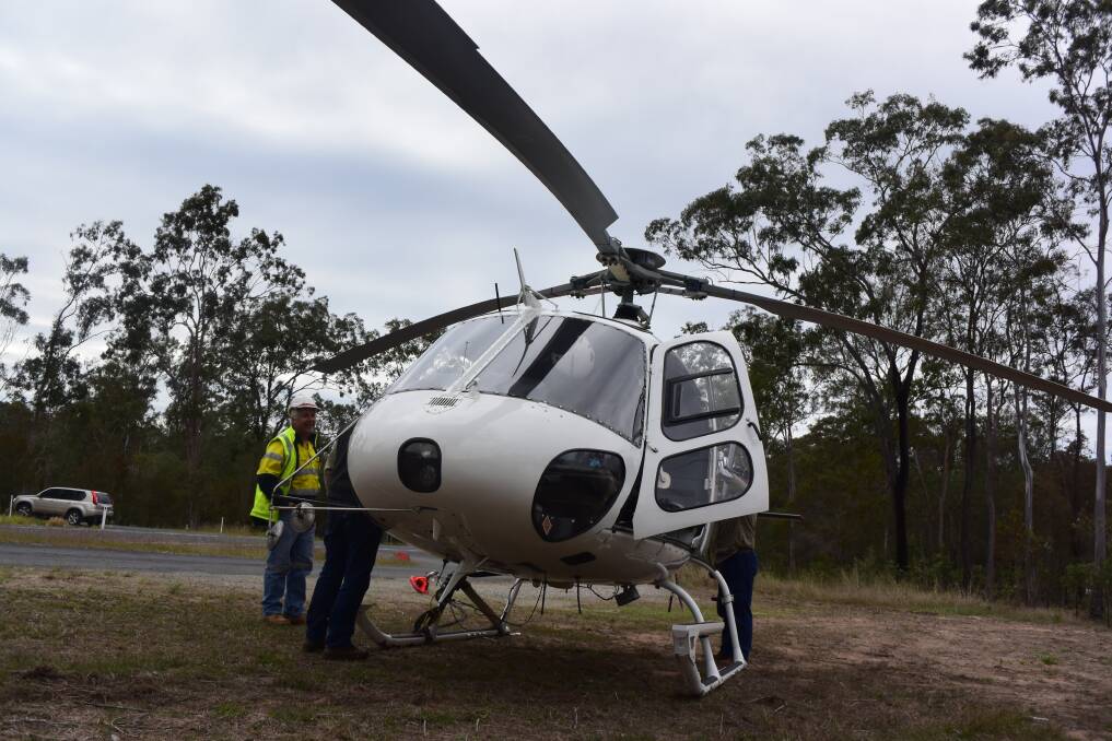 The helicopter lands to refuel between stringing. Photo: Christine Rossouw