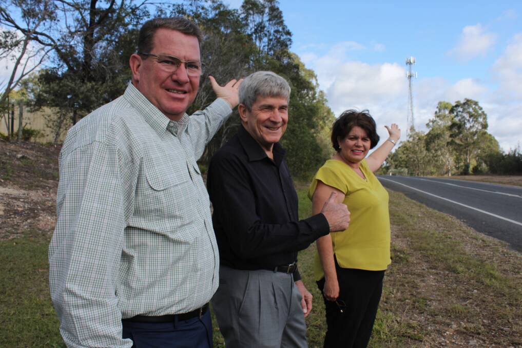 COVERAGE: Federal Member for Wright Scott Buchholz, with Logan Country Safe City Group vice chairman Ray McCabbin and Senator Joanna Lindgren near an existing mobile tower at Greenbank, announces improved mobile coverage for the region. Photo: Supplied