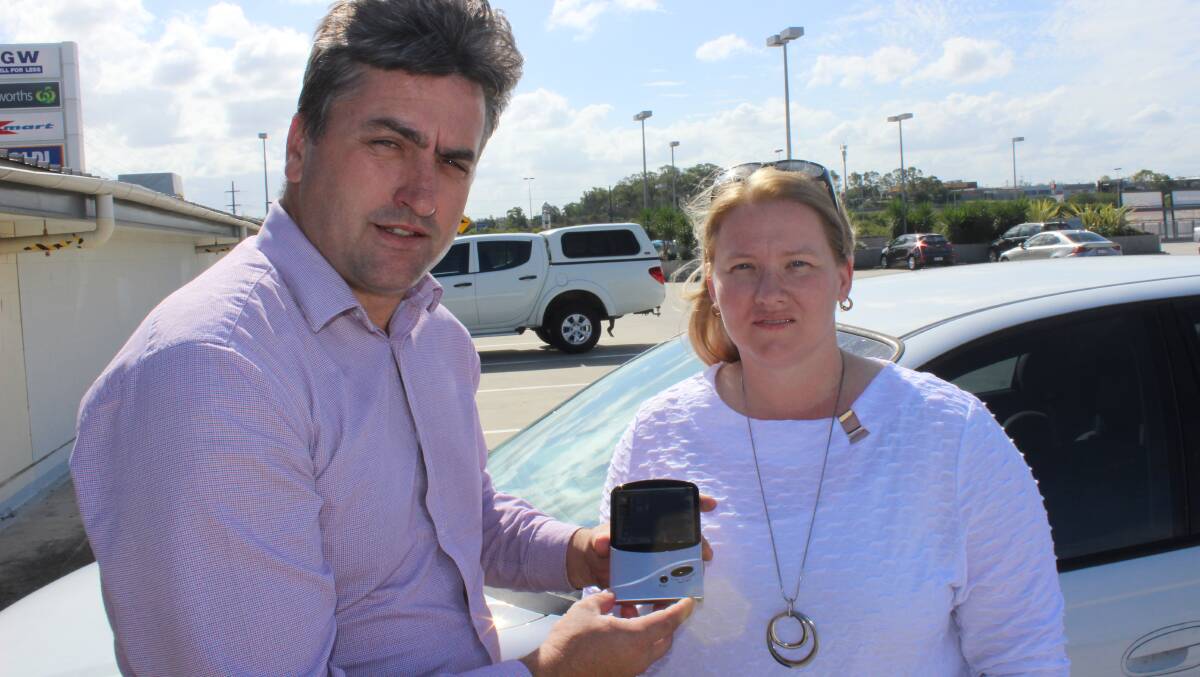 SPREADING THE MESSAGE: Member for Logan Linus Power and Mandy Petrie conducted an experiment on Thursday to warn of the dangers of keeping children, the edlerly or animals in locked hot cars.