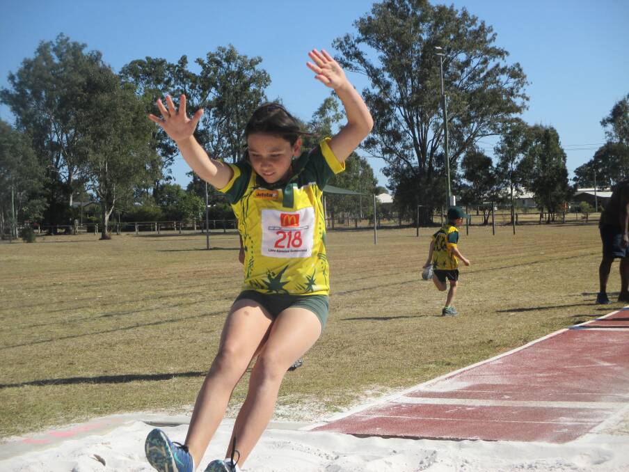 Big leap: Aiesha Irving practices long jump at Jimboomba Little Athletics. Photo: Supplied