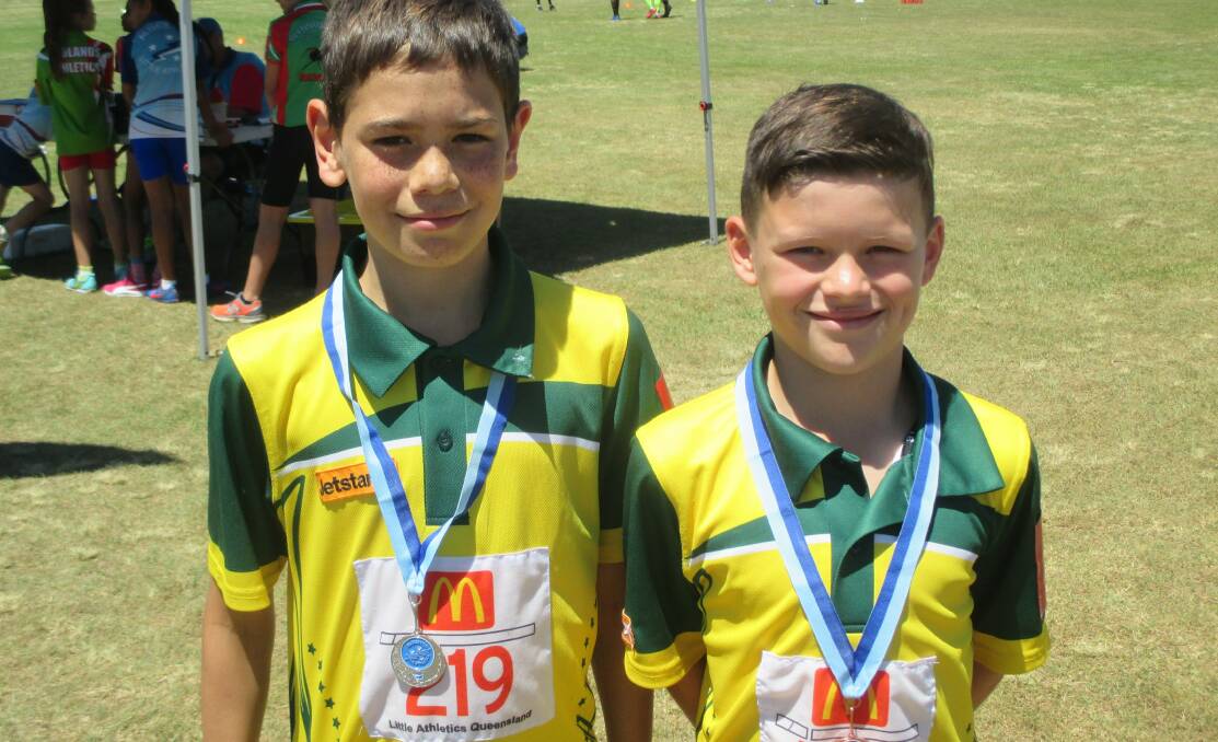 All smiles: Zygmin Irving and Caleb Butler both won a number of medals each at the Algester carnival. Photo: Supplied.