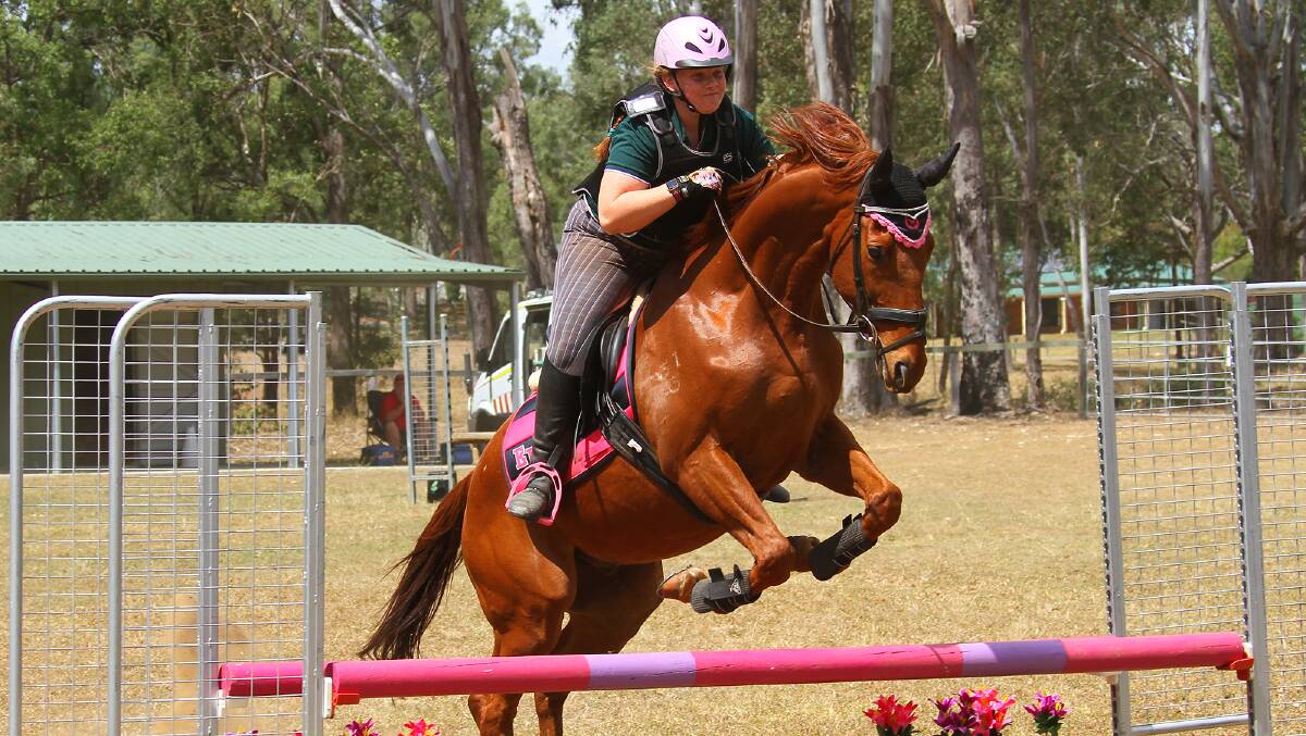 Up and over: Katrina Hosking and her mount negotiate a jump. Photo: Belinda and Pete Trapnell - Trapnell Creations