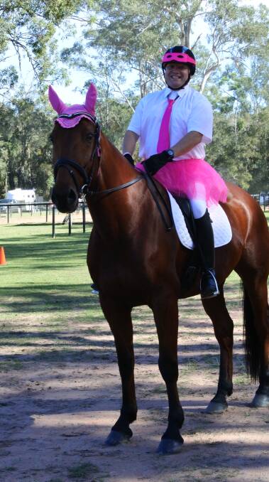 Good fun: A Park Ridge Active Riding Group member and his horse get into the spirit of the Pink Ribbon Fun Day on the weekend. Photo: Supplied