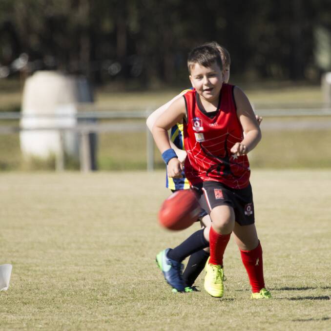 Attack: Jimboomba Redbacks under 9s player Zane Porter chases down a loose ball. Photo: Alex Hodges