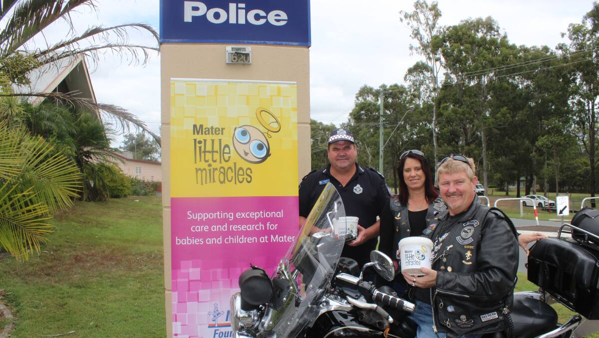 Logan Police Officer Terry Armstrong, with Mt Lindesay Ulyssess club members Tracie Priestley and Rod Talbot.