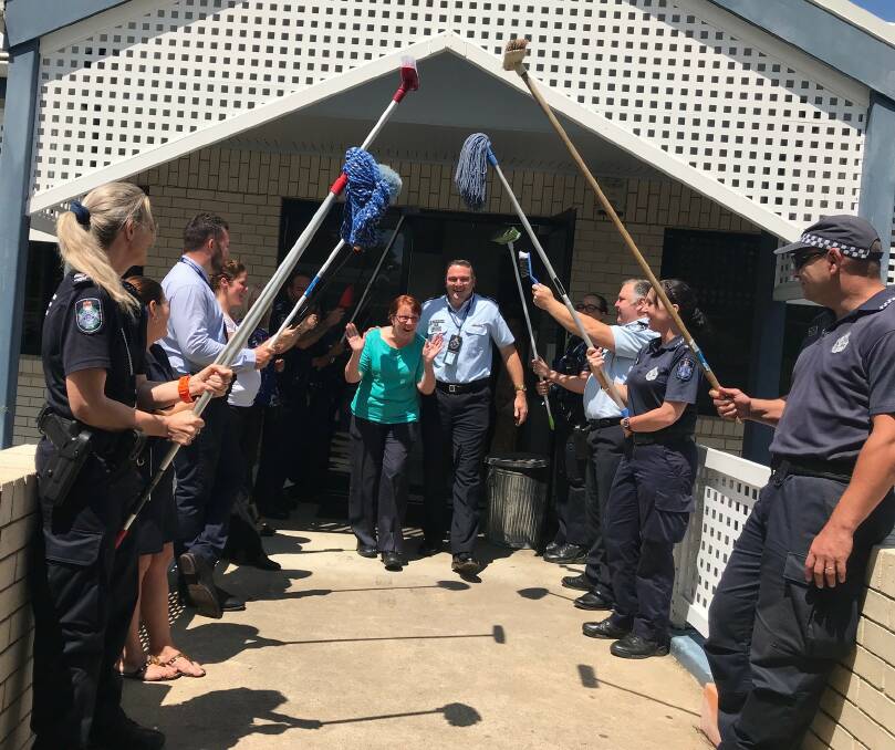 GUARD OF HONOUR: Patricia Quarrie's novel guard of honour as she leaves Browns Plains police station for the last time. Photo: Supplied