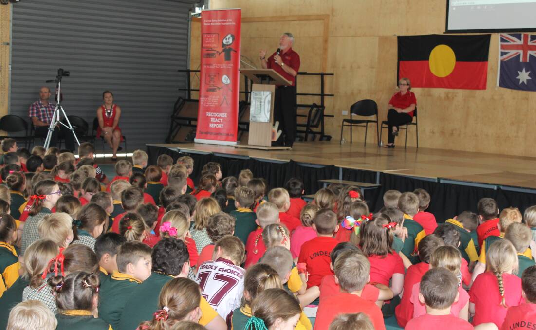 RED: Many students at Jimboomba State School wore red for a visit by Bruce and Denise Morcombe. Photo: Cheryl Goodenough