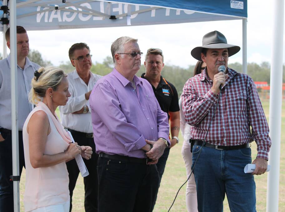 HIGHWAY TALKS: Logan councillor Phil Pidgeon addresses a Highway to Hell meeting at Jimboomba on Saturday. Councillor Trevina Schwarz and Logan Country Safe City Group David Kenny look on. Photo: Cheryl Goodenough