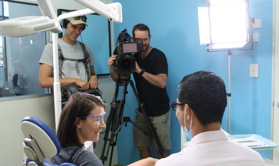 SET FOR TELEVISION: Dentist Dr Jeff Kho, with the Channel Nine crew while filming at J1 Dental Care at Jimboomba on Thursday. Photo: Cheryl Goodenough