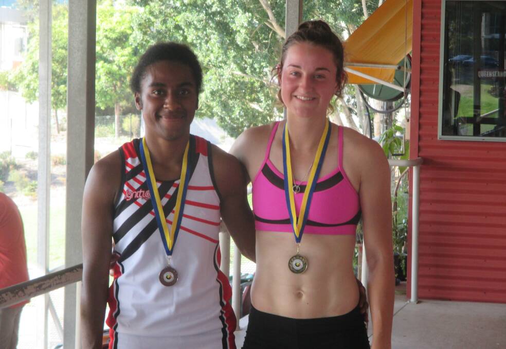 Winners: Runner-up Adrine Monagi is pictured with open women’s heptathlon winner Camryn Newton-Smith, from the Jimboomba club.