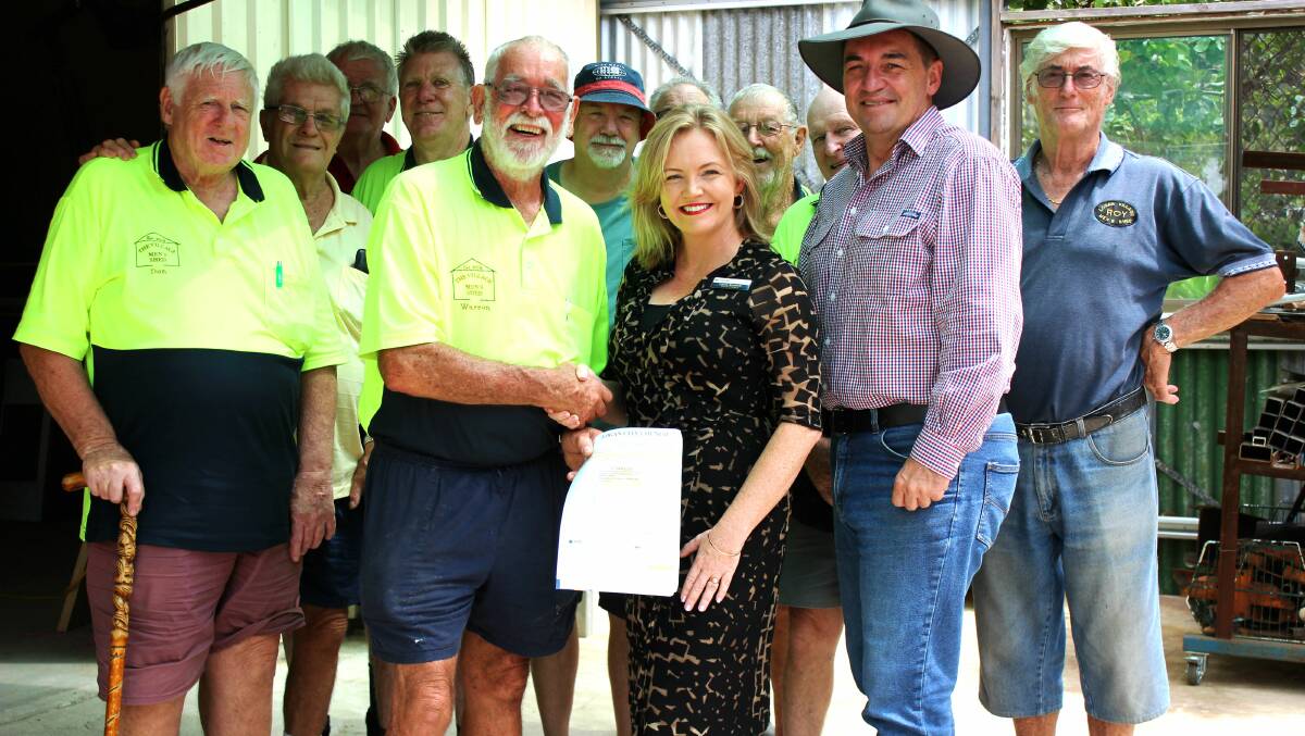 TOGETHERNESS: Logan City Council councillors Laurie Koranski and Phil Pidgeon were pleased to present Logan Village Men's Shed members with a grant to fund a new wood lathe. Photo: Louise Starkey