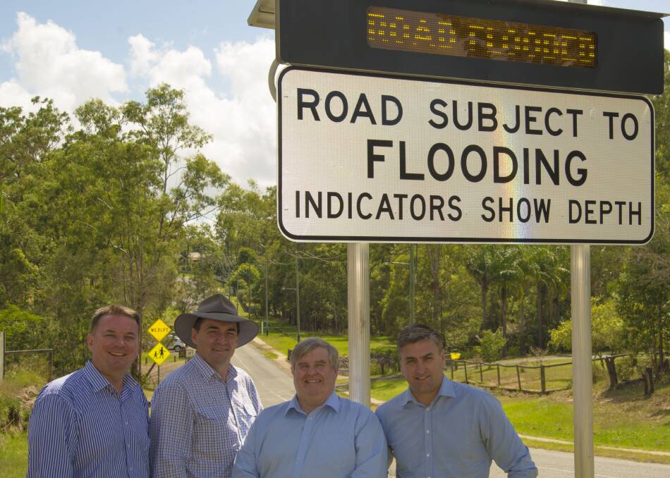 FLOOD WARNING: Logan mayor Luke Smith, Roads and Water Infrastructure chairman  Phil Pidgeon, divisional councillor Laurie Smith and Logan MP Linus Power unveil Logan City Council's latest project.