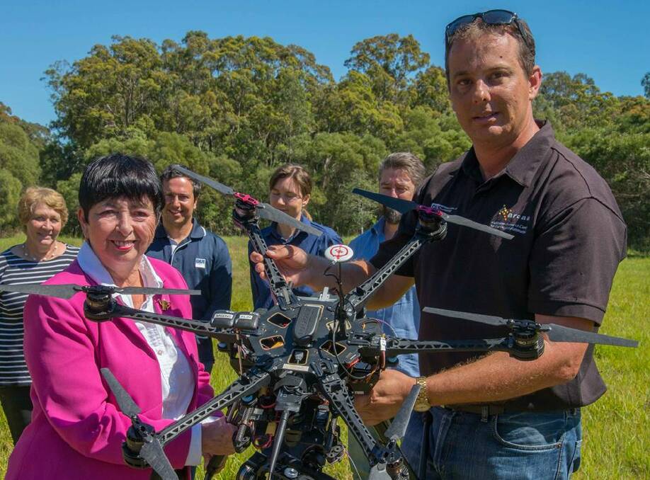 CLOSE UP: Logan City Council deputy mayor Cherie Dalley met with Queensland University of Technology (QUT) researchers at Pimpama to fly drones. Photo: Supplied