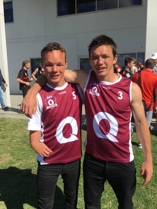 NEVER GIVE UP: John and Brad Lawrence were proud to be in their maroon uniforms at the AFL National Inclusion Carnival. Photo: Supplied