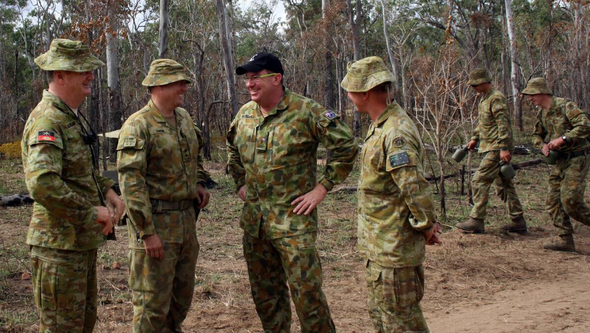 MILITARY EXERCISE: Wright MP Scott Buchholz (second from right) with Australian Defence Force personnel at Shoalwater Bay for Operation Talisman Saber. Photo: Supplied