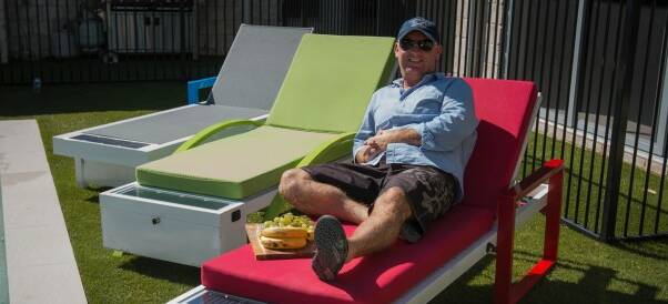 CHILLED: David Hinds relaxes on Solar Sun Lounge. Photo: Supplied