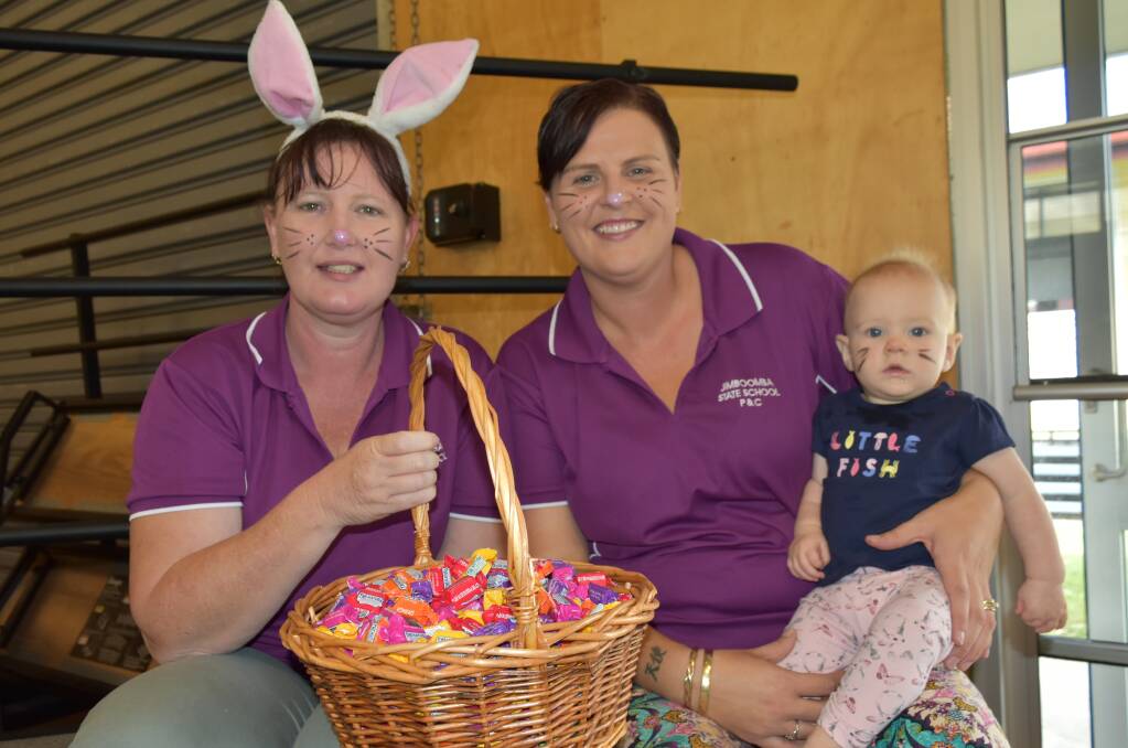 EASTER TREATS: Jimboomba State School P&C mums Christine Lyne and Janet Smith. Ms Smith holds her daughter Stephanie, 7 months. Photo: Hannah Baker