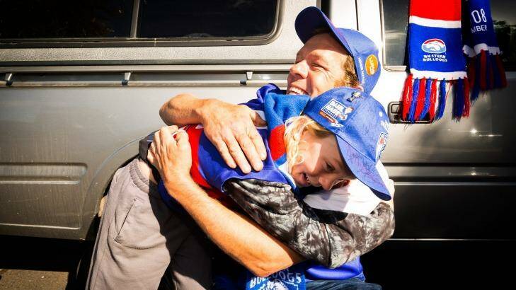 Father and son Sam and Cornelius van Uijtret arrive at Whitton oval after travelling to Sydney on a bus to watch the Western Bulldogs defeat GWS. Photo: Chris Hopkins