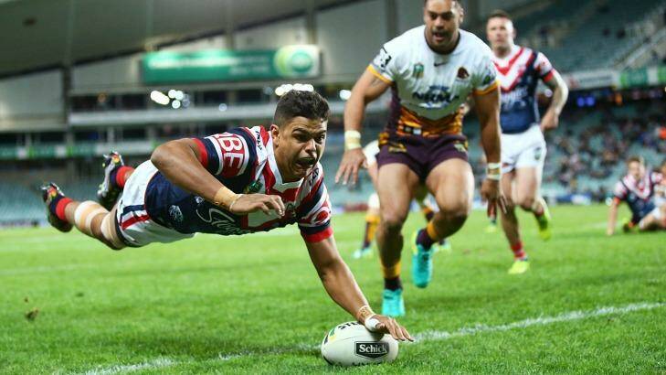 Flying Rooster: Latrell Mitchell dives over the line for a try. Photo: Mark Nolan