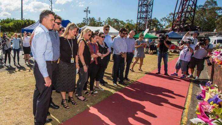 Dreamworld CEO Craig Davidson and his employers pay their respects at Dreamworld where four people died after a malfunction with the Thunder River Rapids ride.  Photo: Glenn Hunt