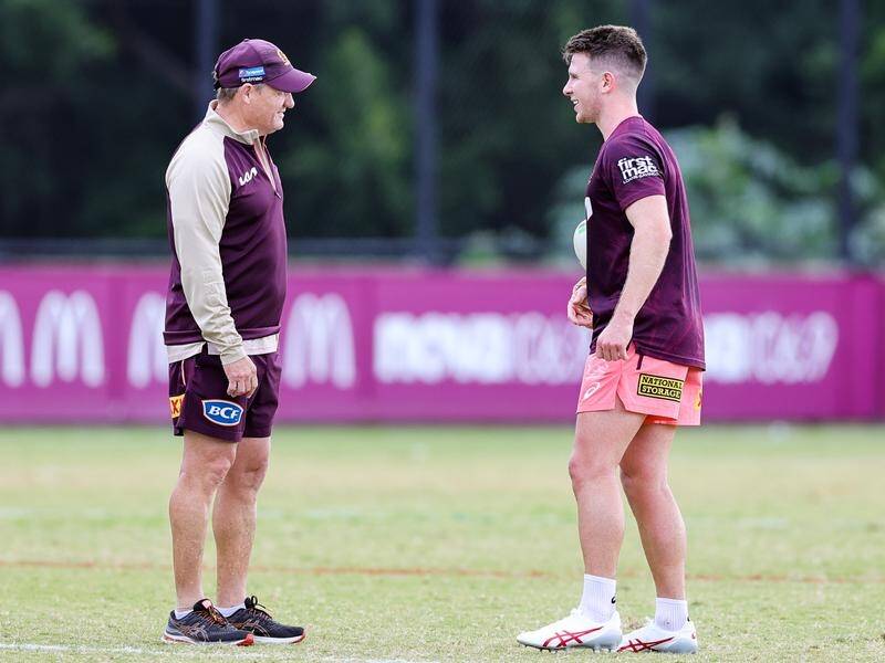 Jock Madden (right) has learned a lot about playmaking from Brisbane coach Kevin Walters (left). (Russell Freeman/AAP PHOTOS)