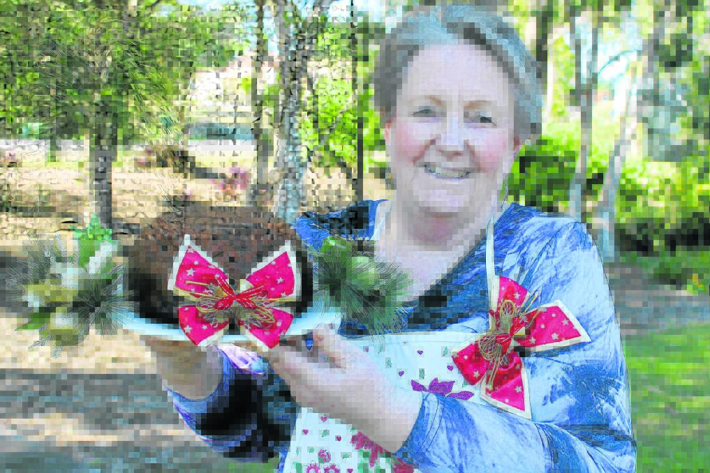 Able Australia Jimboomba Caddies volunteer Teresa Monsiegneur with a sample of the many festive delights she will make for the Christmas in July event this Saturday.