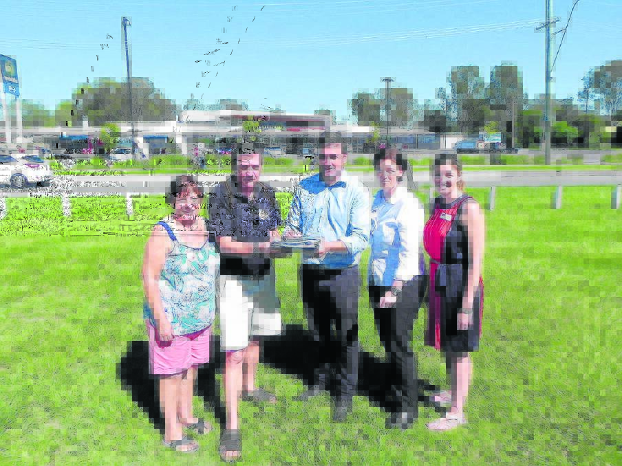 VETO member Deb Gilbert and president Paul Casbolt, with Labor candidates for Albert Melissa McMahon and Waterford Shannon Fentiman look on as Labor candidate for Logan Linus Power (centre) signs a pledge to support an off-river 
route for the power line.