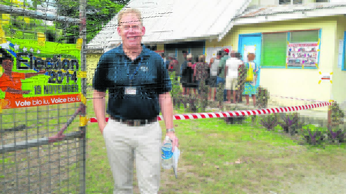 Forde MP Bert van Manen outside a polling booth at a Girl 
Guides centre in Honiara in the Solomon Islands.