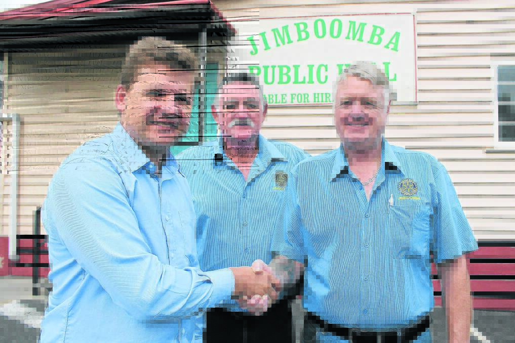 Beaudesert MP Jon Krause congratulates Jimboomba Rotary s Des Madgwick and David Kenny.