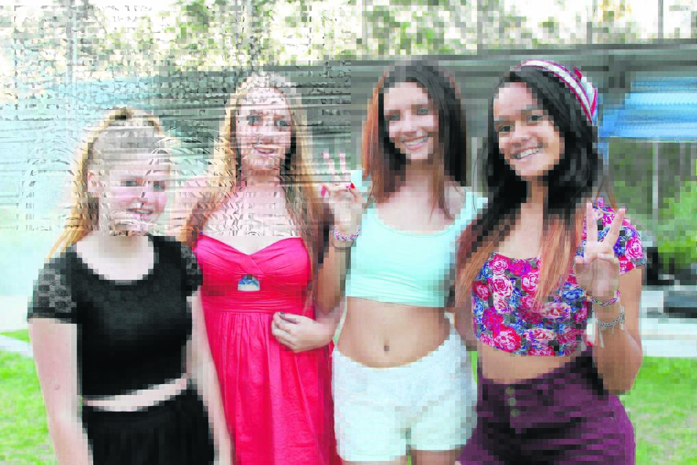 Flagstone State Community College Students Louise Harris, 14, Casey Seager, 15, Katelin Gee-Clark, 14 and Quadele Ginty, 13, caught up at the Youth Week concert.
