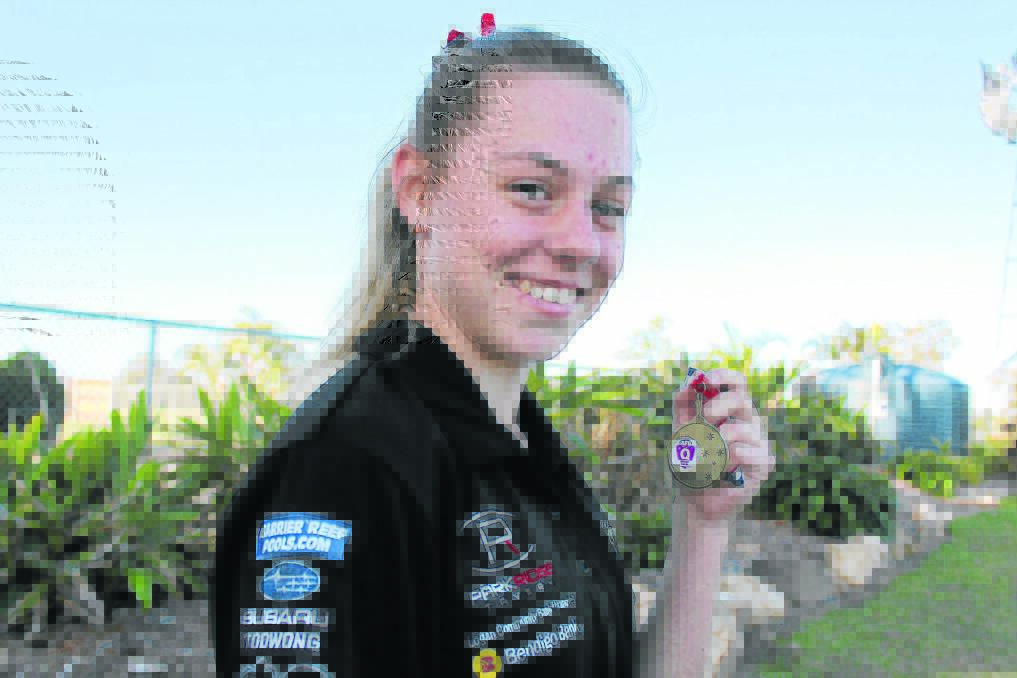 Park Ridge Pirates under 15s girls team captain Courteney 
 Bromage with her best and fairest medal.