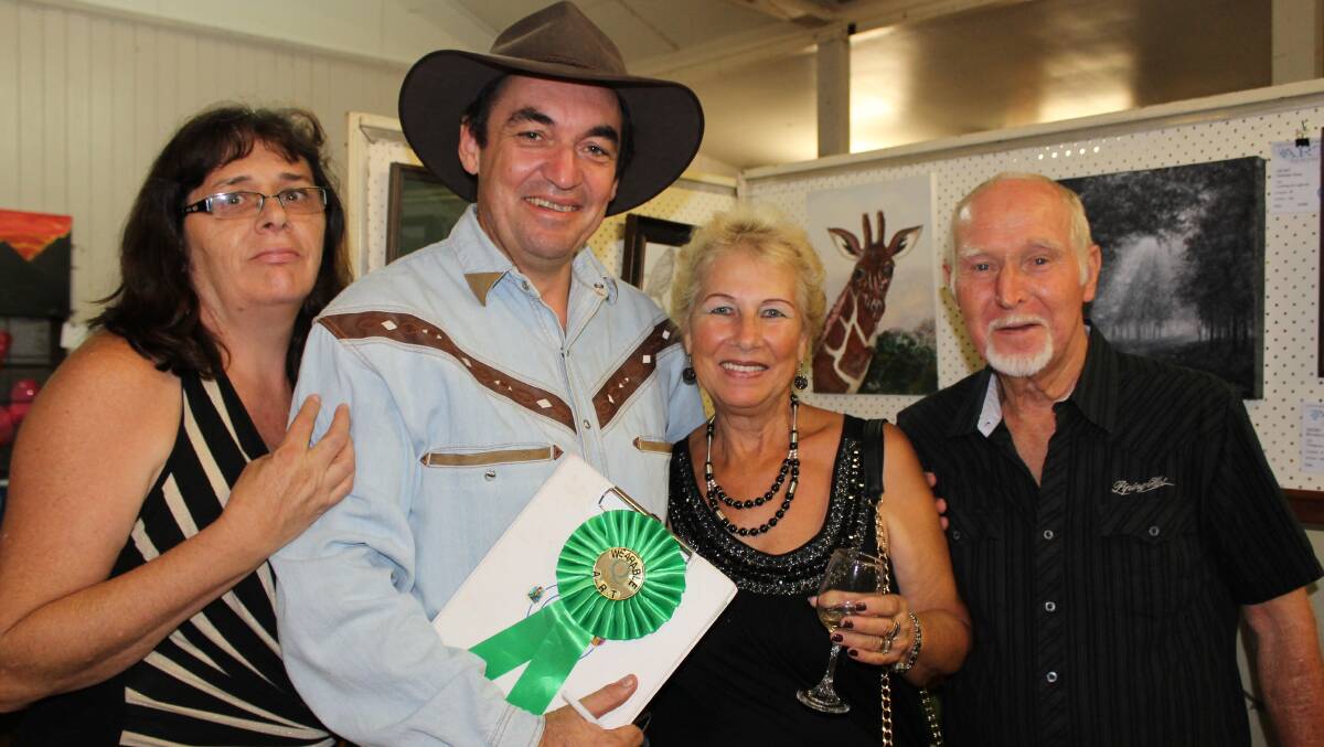 Councillor Phil Pidgeon, judge of the wearable art competition, enjoys the art show with his wife Robyn Pidgeon, artist Renate Voigt and Rupert Voigt.