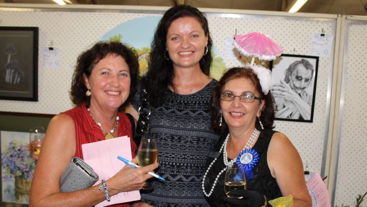 Janet Gormley of Greenbank, painter Kathy Wright of North Maclean and Quota member Frances Ziliotto catch up at the Quota Art Show.