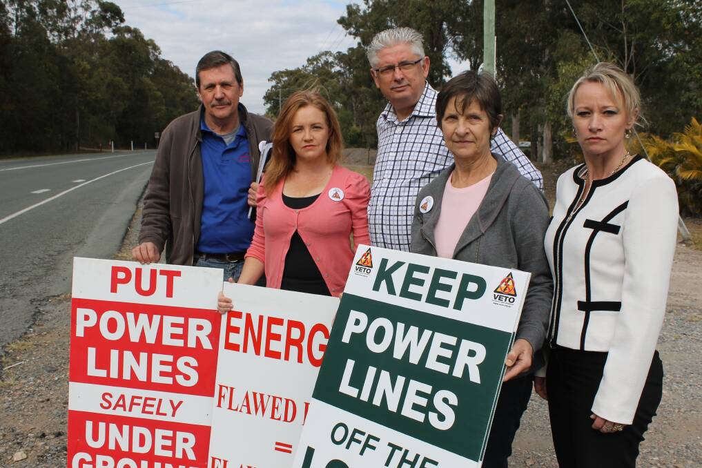 VETO members Paul Casbolt, Laurie Koranski and Linda Casbolt protest the Loganlea to Jimboomba power line last week with support from Logan City Councillors Don Petersen and Trevina Schwarz. 