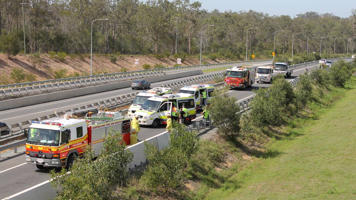 Emergency services respond to a three-car crash on the Mt Lindesay Highway at Munruben. 