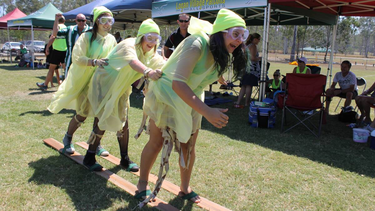 Emmaus College students Molly Sterle, 13, Hayley Butt, 13, and Ruby Turner, 12, work together in one of the It’s A Knockout contests. 