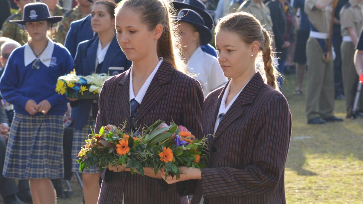 Emmaus College school captain Amy Partridge and fellow student Ashleigh Scurr lay a wreath on behalf of the school.