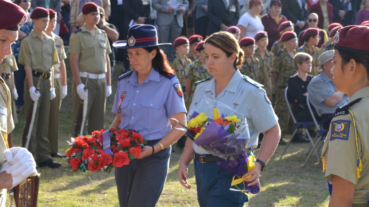 Jimboomba Fire Brigade Lieutenant Gail Steppens and Jimboomba Advanced Care Paramedic Sue Neale lay wreaths on behalf of the emergency services.