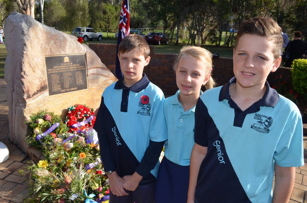 Ethan Hayes, Saffron Cairns and Levi Cairns of Flagstone State School paid their respects at the Jimboomba service.