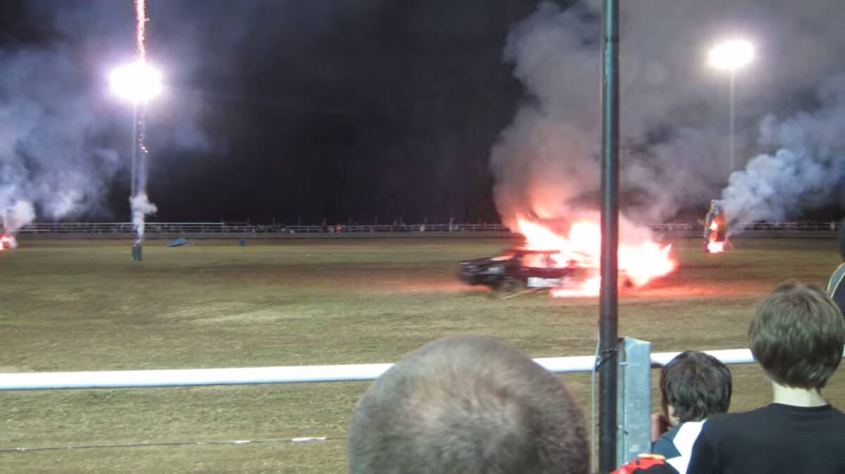 The moment of impact, when a demolition derby driver's car became engulfed in flames after driving into a flaming wreck during a stunt show at the Beaudesert Show.