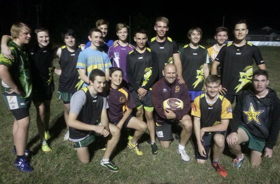 Rugby league legend Mick Hancock with Jimboomba Thunder players.