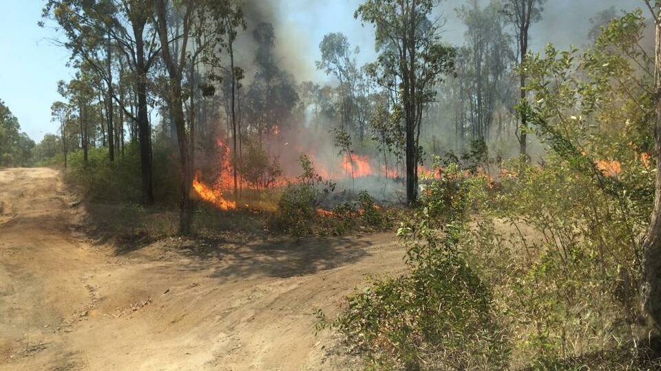 A bushfire is burning near Yarrabilba. Source: Logan Village Rural Fire Brigade Facebook page.