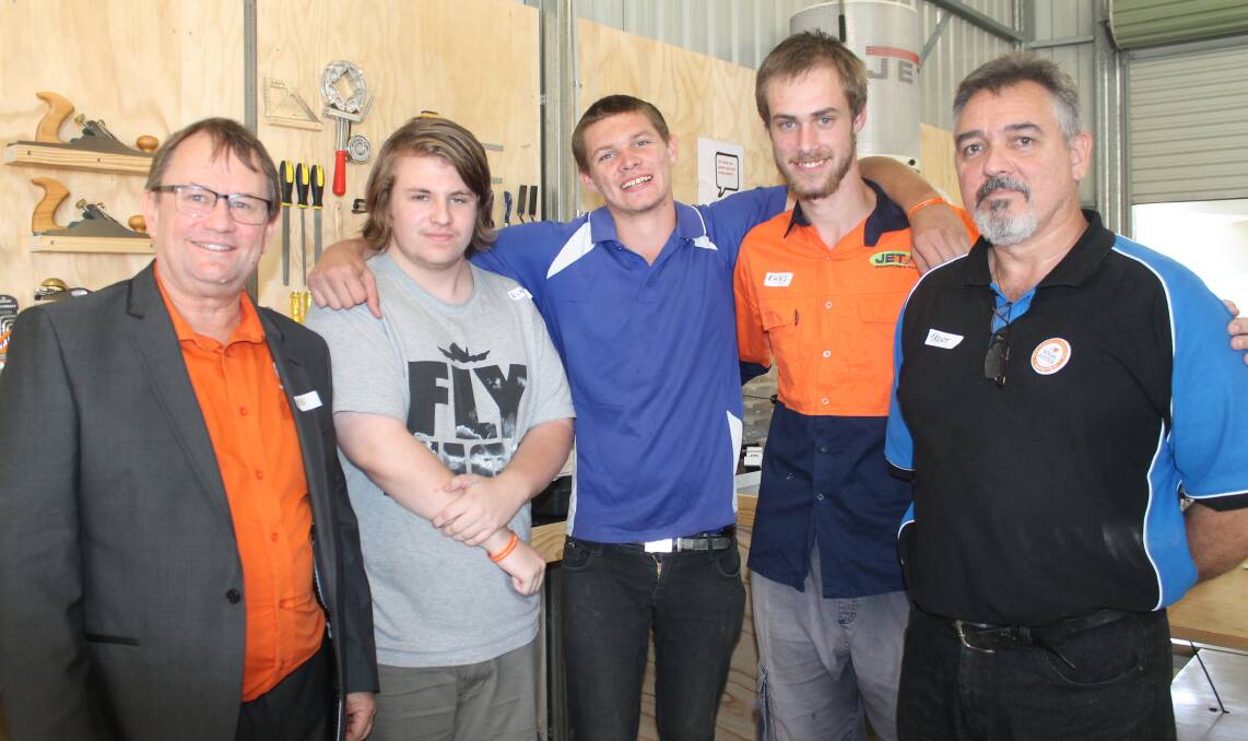 The Spot executive director Ken Houliston, Chambers Flat teen Ryan Eyears, Boronia Heights man Daniel Roope, Crestmead man Rhys Sharp and Rock in Design coordinator Trent Powrie celebrate the official launch of the program on Wednesday.