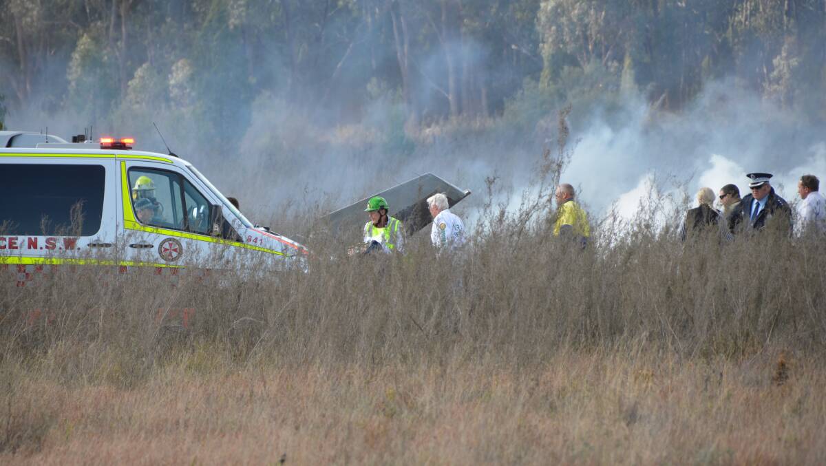 Emergency services scramble at the scene of yesterday’s fiery plane crash . Photo: The Inverell Times